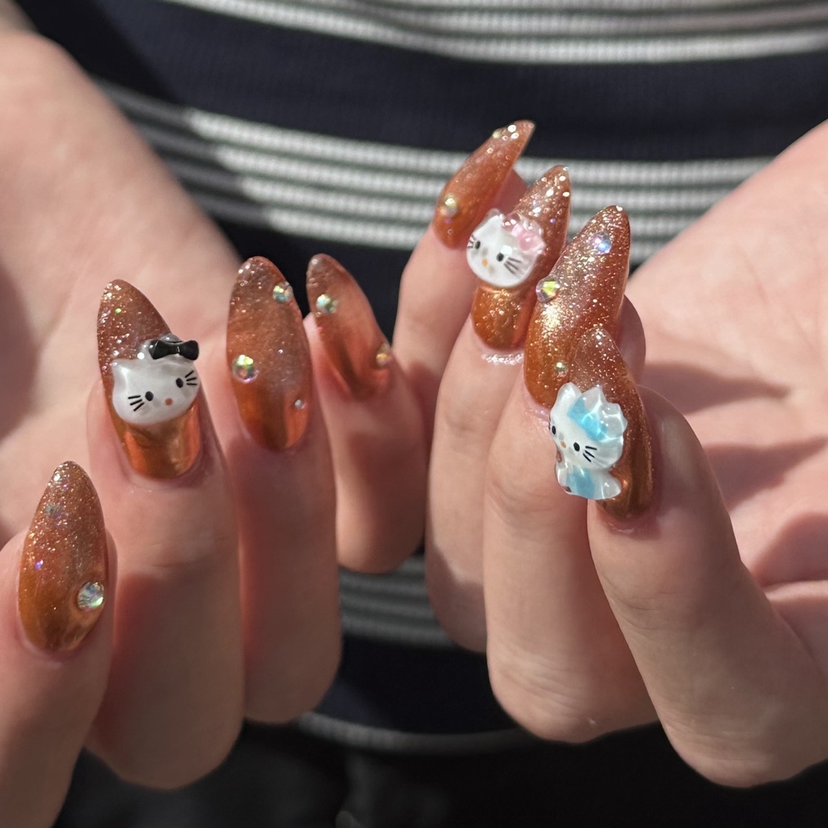 Wanghong style nail art with orange glitter at blancher nail salon in Tokyo